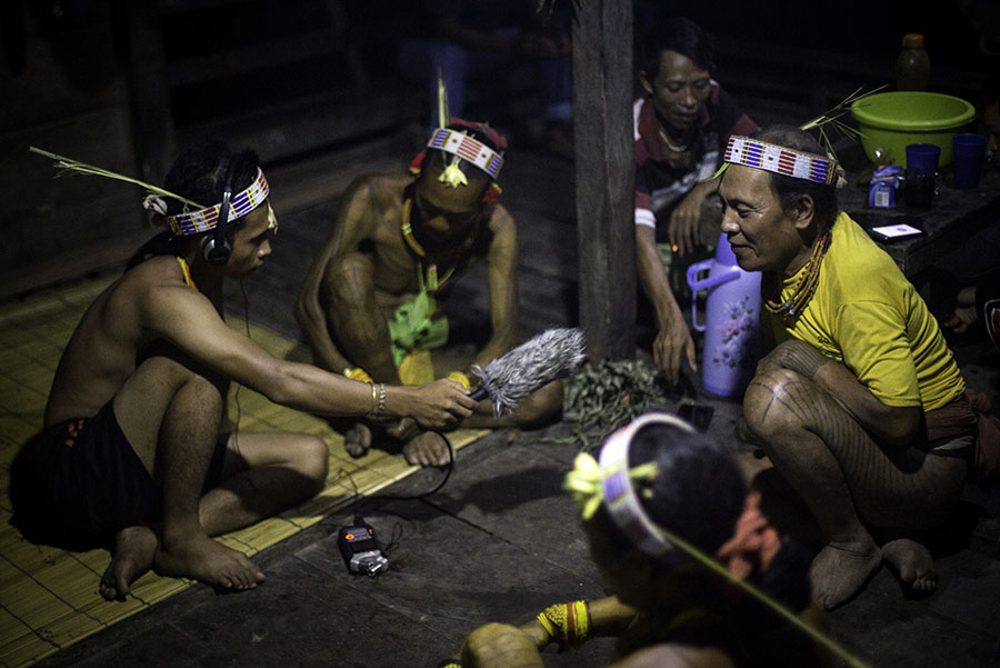 Suku Mentawai team gathering oral literature recordings during a research project