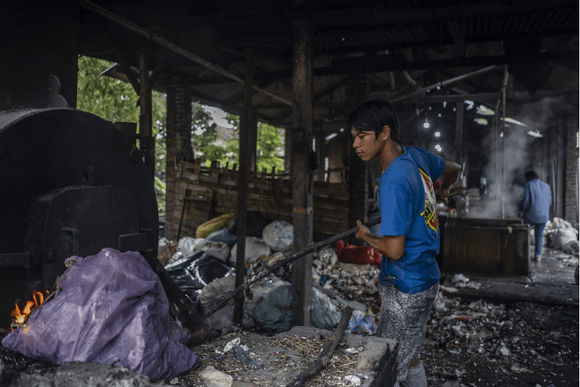 Photo 3 – Imported plastic waste being used as fuel in a tofu factory, Surabaya, Indonesia. Source: https://www.no-burn.org/discarded-report-indonesia/#:~:text=A%20year%20ago%2C%20North%20Sumengko,of%20maize%20and%20rice%20fields