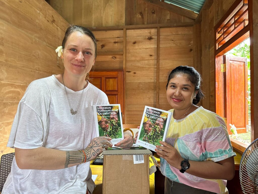 Santi and Samantha with the SIberut Plant Field Guide, english translation